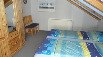 Ein Bett oder Betten in einem Zimmer der Unterkunft Ferienwohnung Sommer