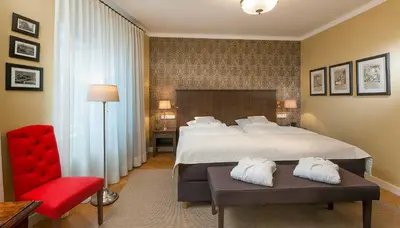 Ein Bett oder Betten in einem Zimmer der Unterkunft Boutique-Hotel Moseltor