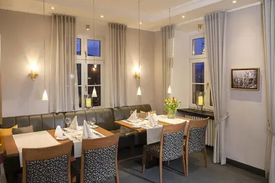 Ein Restaurant oder anderes Speiselokal in der Unterkunft Boutique-Hotel Moseltor