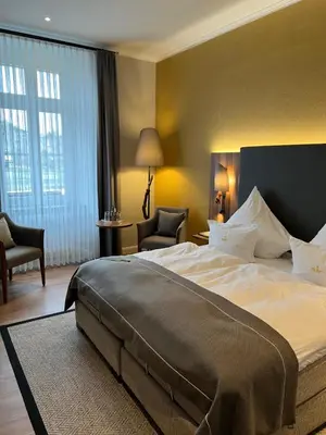 Ein Bett oder Betten in einem Zimmer der Unterkunft Boutique-Hotel Moseltor