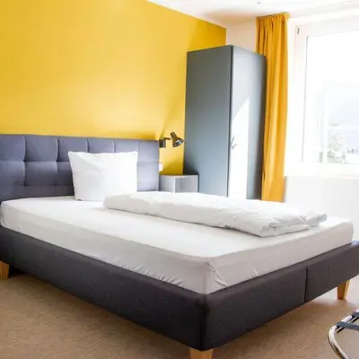 Ein Bett oder Betten in einem Zimmer der Unterkunft Hotel Trabener Hof