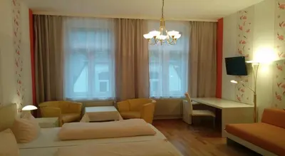 Ein Bett oder Betten in einem Zimmer der Unterkunft Kurhotel Quellenhof