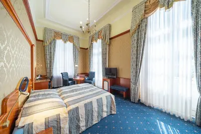 Ein Bett oder Betten in einem Zimmer der Unterkunft Häcker's Hotel