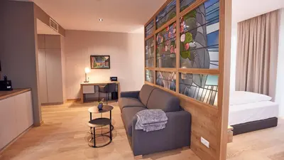Ein Bett oder Betten in einem Zimmer der Unterkunft Seehotel Maria Laach