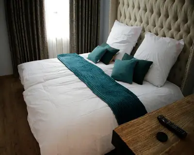 Ein Bett oder Betten in einem Zimmer der Unterkunft Z&B Hotel