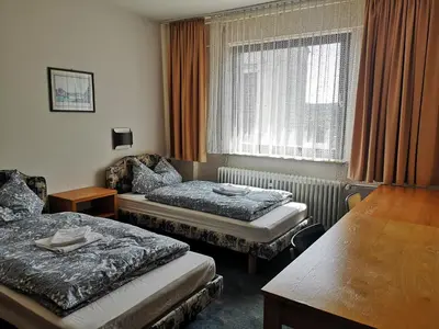 Ein Bett oder Betten in einem Zimmer der Unterkunft LandhotelUllrich