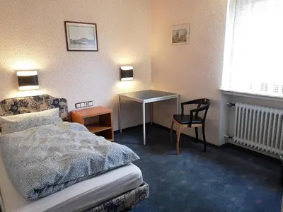 Ein Bett oder Betten in einem Zimmer der Unterkunft LandhotelUllrich
