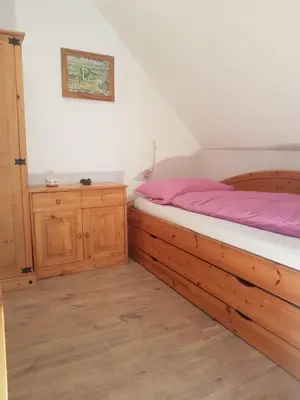 Ein Bett oder Betten in einem Zimmer der Unterkunft Komfort Ferienhaus FEWO70