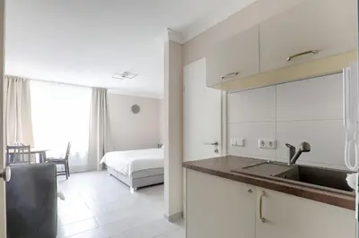 Ein Bett oder Betten in einem Zimmer der Unterkunft H-Apartments Bismarckstrasse