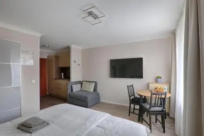 Ein Bett oder Betten in einem Zimmer der Unterkunft H-Apartments Bismarckstrasse