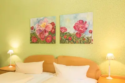 Ein Bett oder Betten in einem Zimmer der Unterkunft Hotel Leander