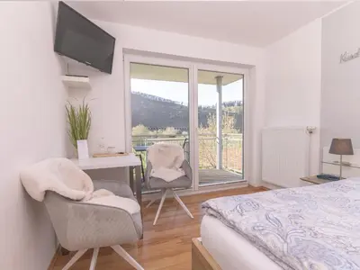 Ein Bett oder Betten in einem Zimmer der Unterkunft Ferienweingut Lütz