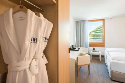 Ein Bett oder Betten in einem Zimmer der Unterkunft NH Bingen