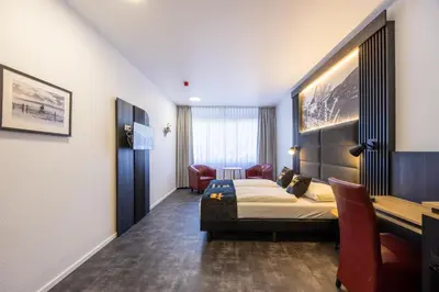 Ein Bett oder Betten in einem Zimmer der Unterkunft Panorama Hotel Rheinkrone