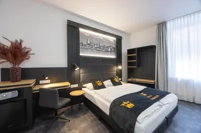 Ein Bett oder Betten in einem Zimmer der Unterkunft Panorama Hotel Rheinkrone
