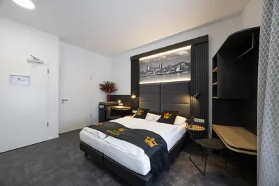Ein Bett oder Betten in einem Zimmer der Unterkunft Panorama Hotel Rheinkrone