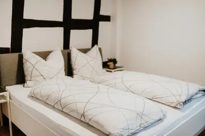 Ein Bett oder Betten in einem Zimmer der Unterkunft Fachwerkhäuschen