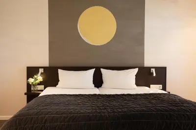 Ein Bett oder Betten in einem Zimmer der Unterkunft Hotel Vulcano Lindenhof