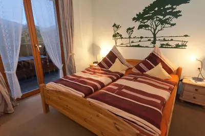 Ein Bett oder Betten in einem Zimmer der Unterkunft Wolffhotel