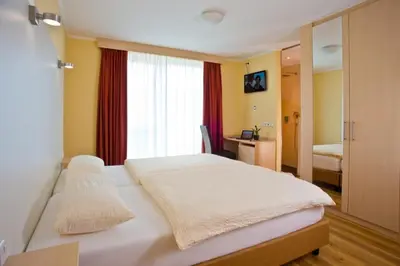 Ein Bett oder Betten in einem Zimmer der Unterkunft Rotenberg PT Hotel
