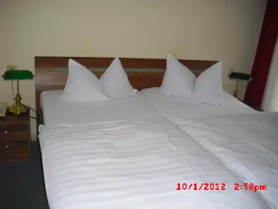 Ein Bett oder Betten in einem Zimmer der Unterkunft Hotel Feilen-Wolff