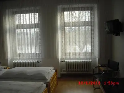 Ein Bett oder Betten in einem Zimmer der Unterkunft Hotel Feilen-Wolff
