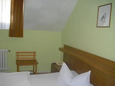 Ein Bett oder Betten in einem Zimmer der Unterkunft Hotel Feilen-Wolff