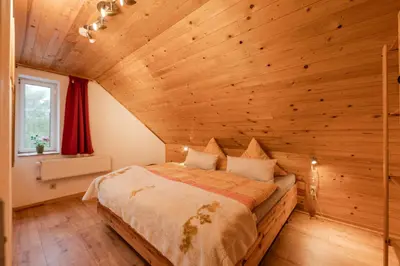 Ein Bett oder Betten in einem Zimmer der Unterkunft Ferienhaus Störzel Wohnung B