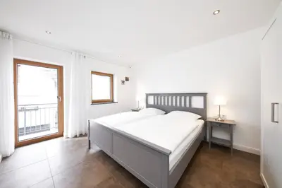 Ein Bett oder Betten in einem Zimmer der Unterkunft Ferienwohnung Riesling