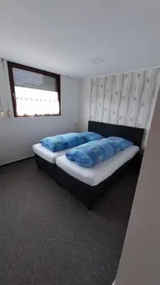 Ein Bett oder Betten in einem Zimmer der Unterkunft Hotel & Restaurant - Zum Schleicher Kuckuck