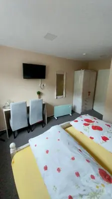 Ein Bett oder Betten in einem Zimmer der Unterkunft Hotel & Restaurant - Zum Schleicher Kuckuck