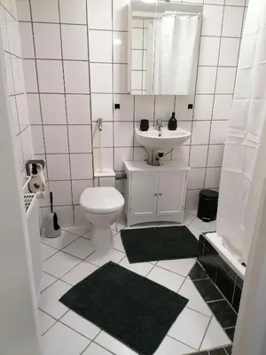 Ein Badezimmer in der Unterkunft Creek Inn, Contactless Check-in