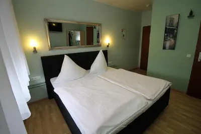 Ein Bett oder Betten in einem Zimmer der Unterkunft Hotel Geromont