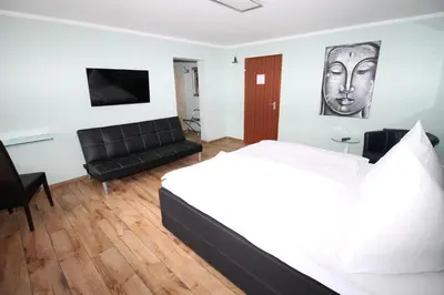 Ein Bett oder Betten in einem Zimmer der Unterkunft Hotel Geromont