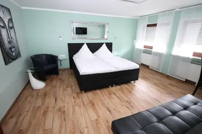 Ein Bett oder Betten in einem Zimmer der Unterkunft Hotel Geromont