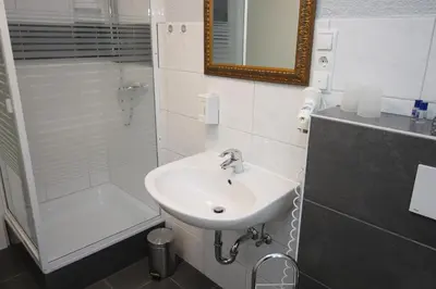 Ein Badezimmer in der Unterkunft Hotel Geromont