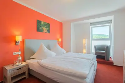 Ein Bett oder Betten in einem Zimmer der Unterkunft Hotel Koch Schilt