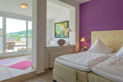Ein Bett oder Betten in einem Zimmer der Unterkunft Hotel Koch Schilt