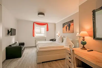 Ein Bett oder Betten in einem Zimmer der Unterkunft Hotel Koch Schilt