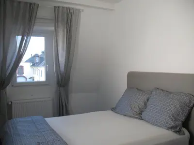 Ein Bett oder Betten in einem Zimmer der Unterkunft Moselhaus Tante Emma
