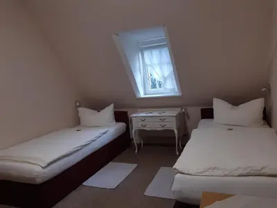 Ein Bett oder Betten in einem Zimmer der Unterkunft Pension Marienhof