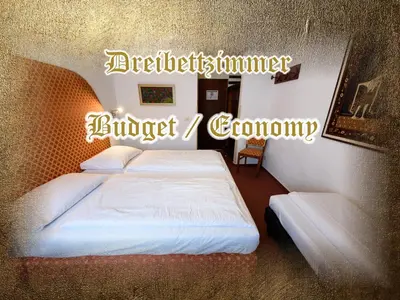 Ein Bett oder Betten in einem Zimmer der Unterkunft Burg-Hotel & Hostel Cochem