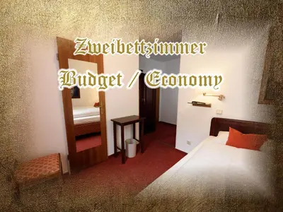 Ein Bett oder Betten in einem Zimmer der Unterkunft Burg-Hotel & Hostel Cochem
