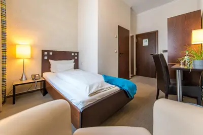 Ein Bett oder Betten in einem Zimmer der Unterkunft Hotel Stein - Schiller's Manufaktur