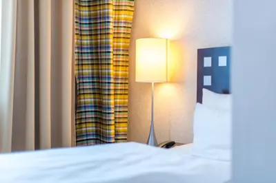 Ein Bett oder Betten in einem Zimmer der Unterkunft Hotel Stein - Schiller's Manufaktur