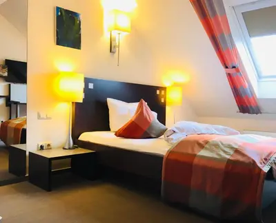 Ein Bett oder Betten in einem Zimmer der Unterkunft Hotel Stein - Schiller's Manufaktur
