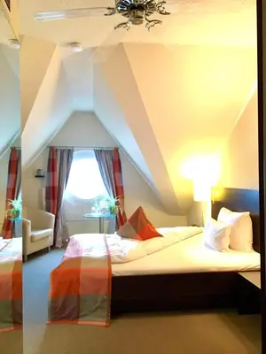 Ein Bett oder Betten in einem Zimmer der Unterkunft Hotel Stein - Schiller's Manufaktur