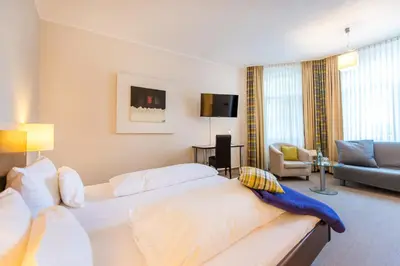Ein Bett oder Betten in einem Zimmer der Unterkunft Hotel Stein - Schiller's Manufaktur