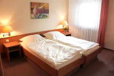 Ein Bett oder Betten in einem Zimmer der Unterkunft Hotel Niederée
