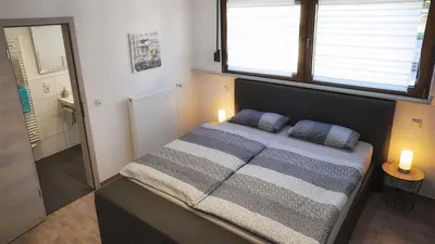 Ein Bett oder Betten in einem Zimmer der Unterkunft Ferienwohnung Traumblick
